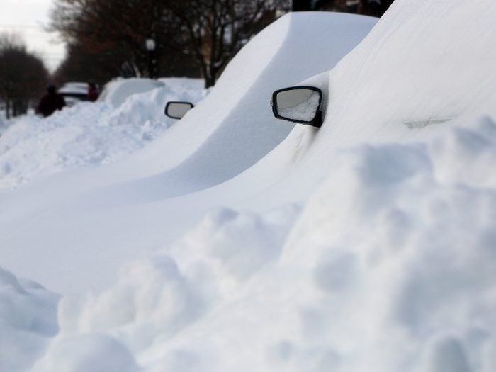 Cars buried in deep snow