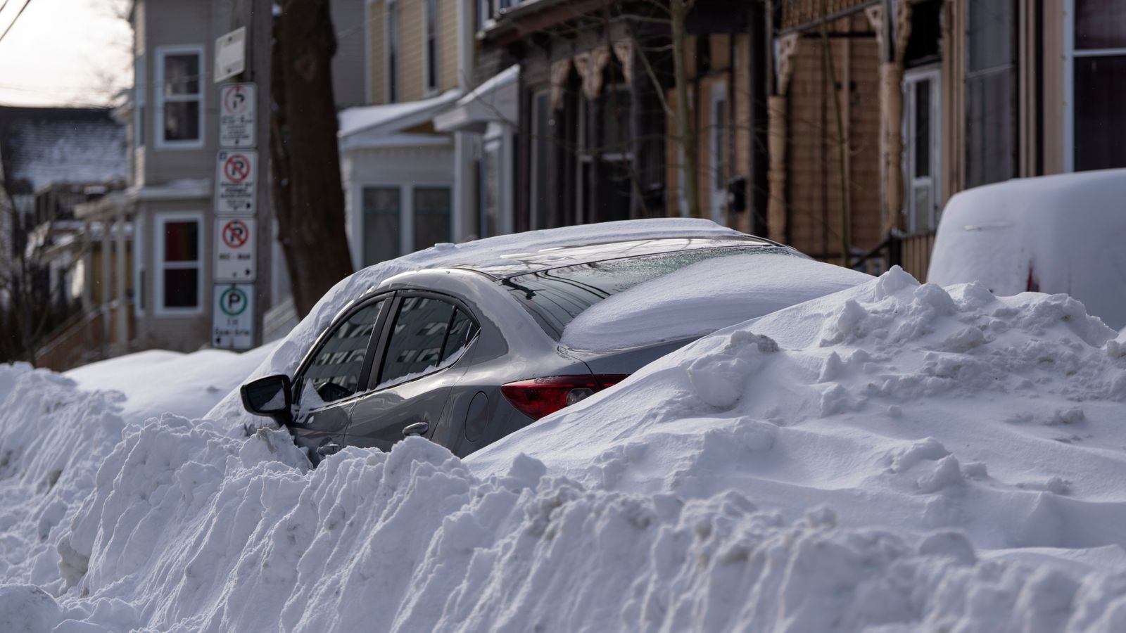 Car buried in snow after storm